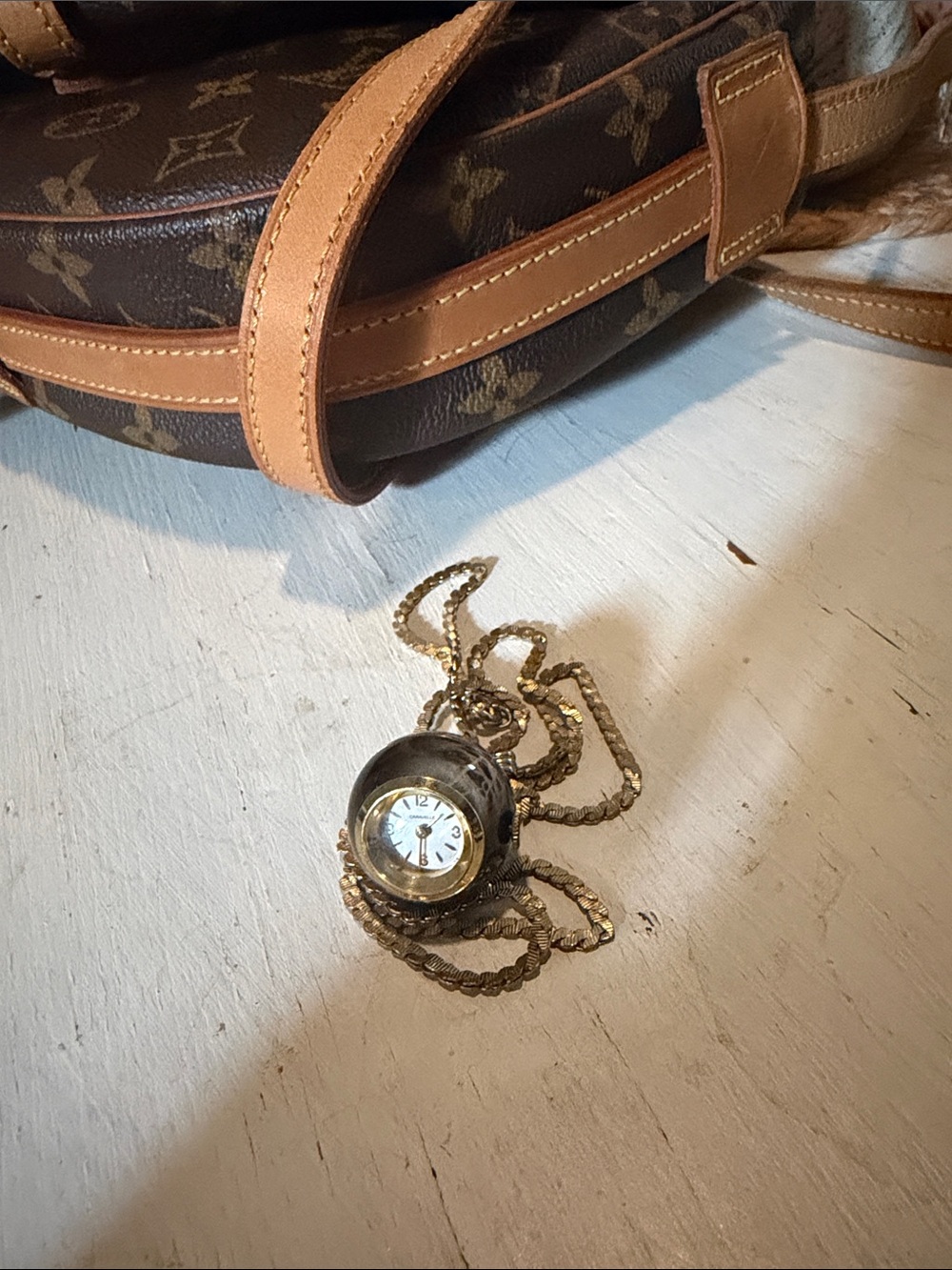 Caravelle by Bulova 1960s Black Gold
Tone Enamel Ball Pendant Watch
Necklace